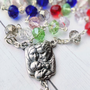 A close up of the holy family centerpiece that was chosen for a family birthstone rosary