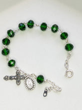 Load image into Gallery viewer, A close up of a dark emerald green rosary bracelet on a white background